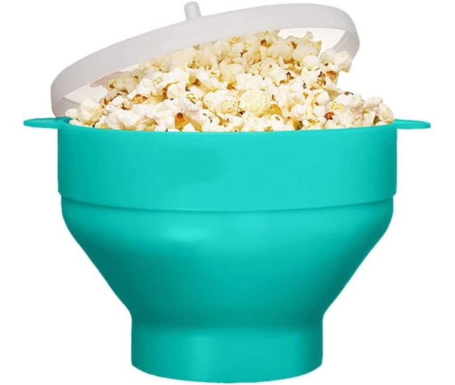Lime green collapsible silicone popcorn bowl with its lid beside it