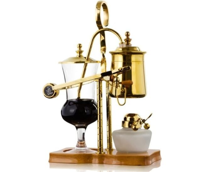 Gold-coloured balance siphon coffee maker with a glass globe, brass frame and counterweighted arm