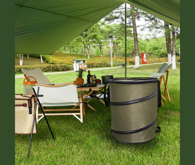 Two pop-up collapsible camping bins standing open on grass