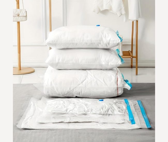 Vacuum storage bags compressing a doona, with the hand pump alongside